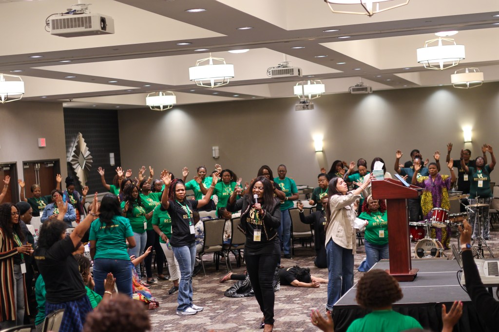 Women in worship during women conference.
